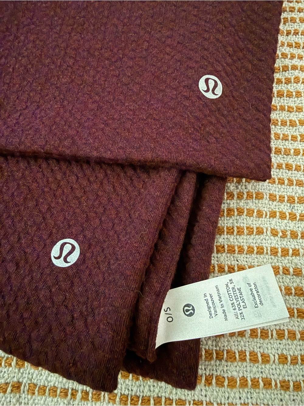 Lululemon Textured Maroon At Ease Scarf featuring the signature Logo NWOT